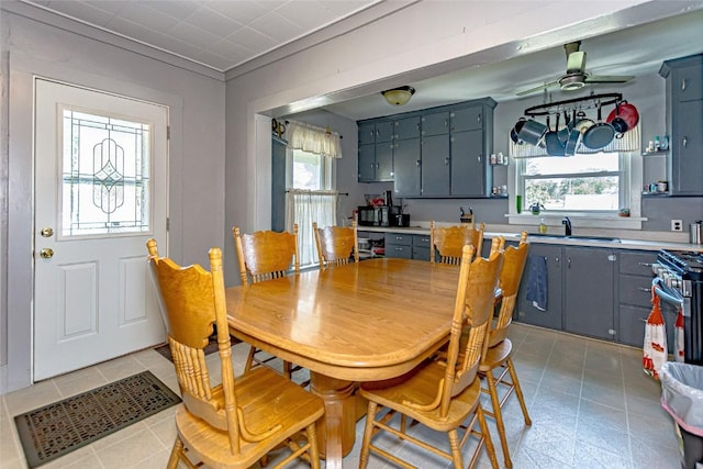 dining room featuring sink and ceiling fan