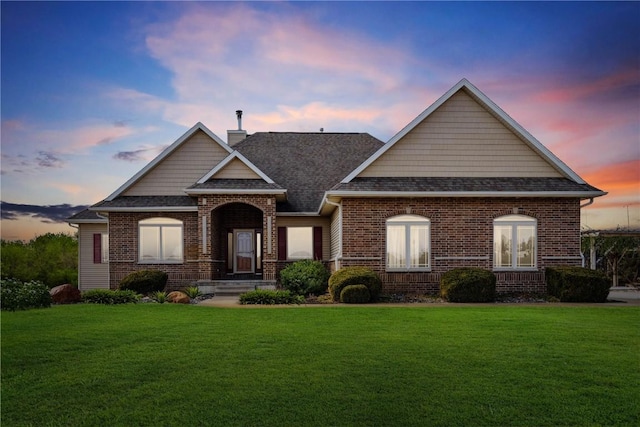 craftsman-style house with a lawn