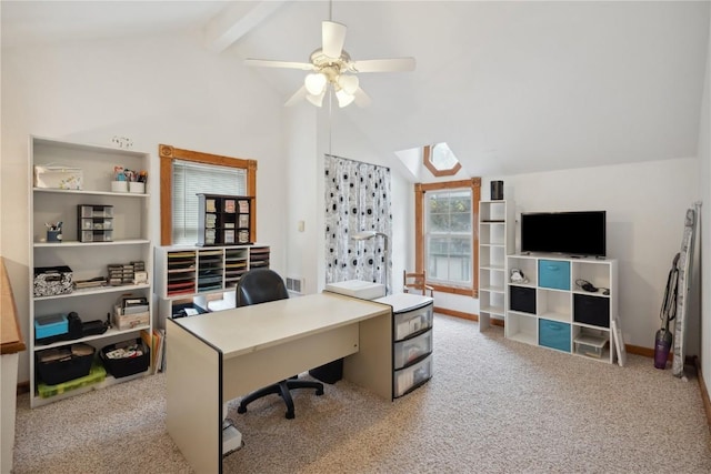 office space with lofted ceiling with beams, light colored carpet, and ceiling fan