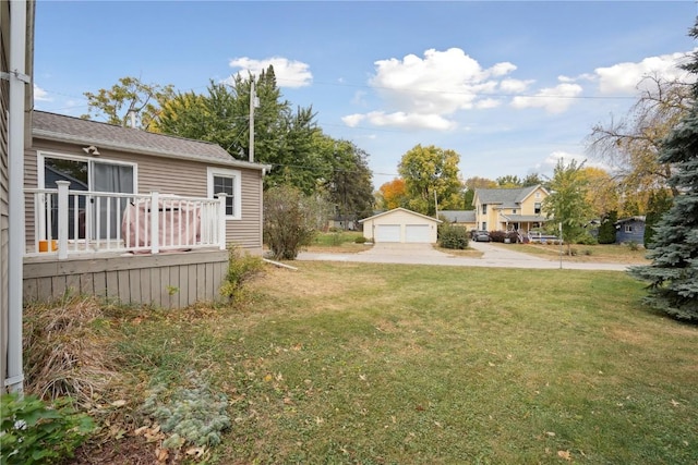 view of yard with a garage and an outdoor structure