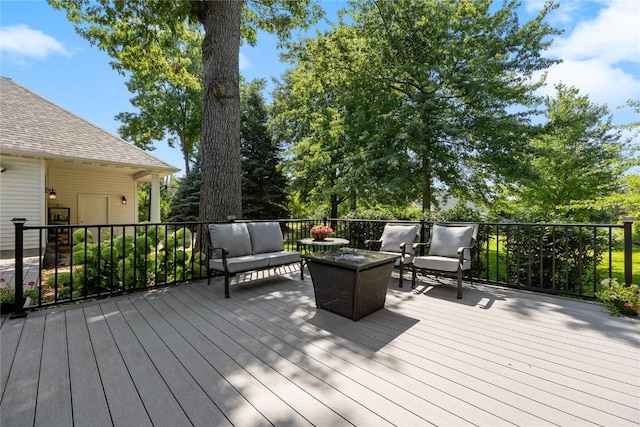 wooden terrace featuring outdoor lounge area