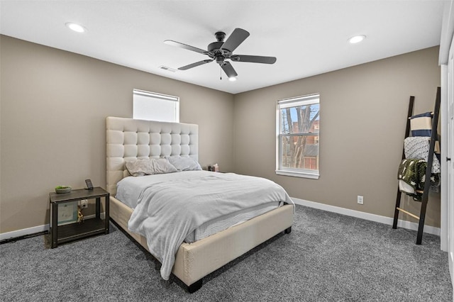 bedroom with ceiling fan and dark carpet