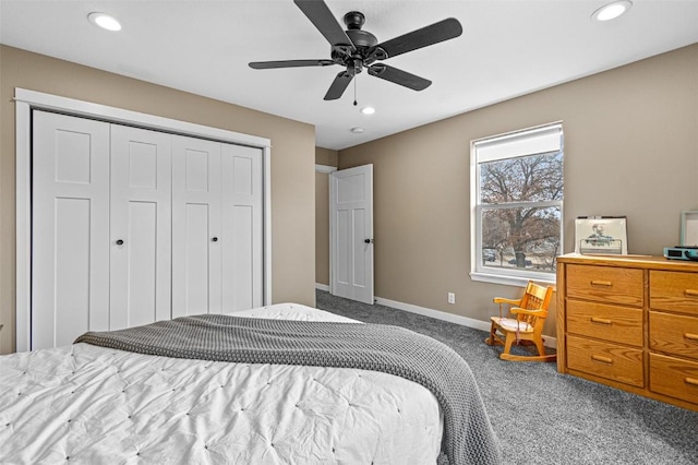 carpeted bedroom with ceiling fan and a closet