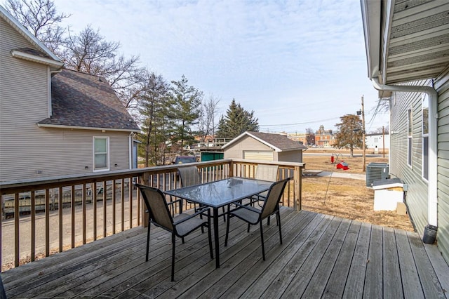 deck featuring a garage and an outdoor structure