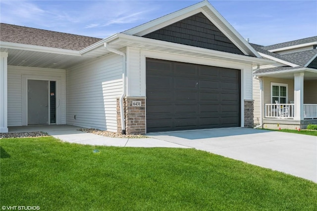 6431 Rookwood Ln, Marion, IA 52302 - view of front of house with a shingled roof, driveway, a front lawn, and a garage