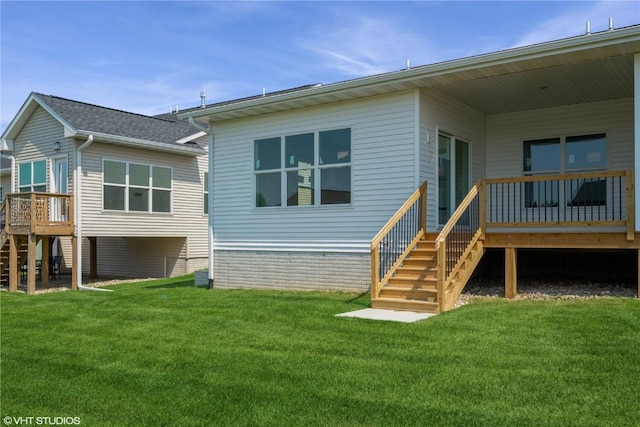 6431 Rookwood Ln, Marion, IA 52302 - back of property featuring stairway, a deck, and a lawn