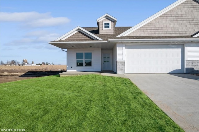 view of front of home featuring a garage and a front lawn