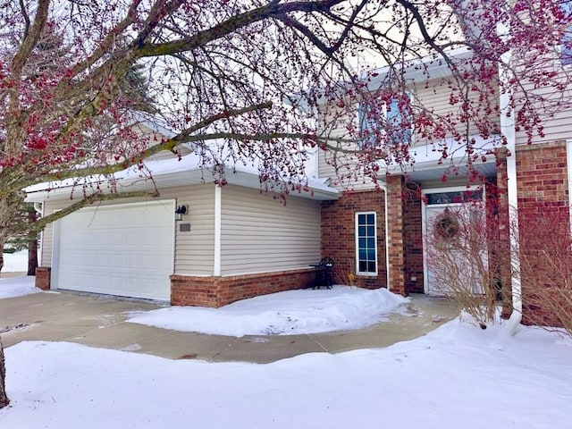 view of front of property with a garage