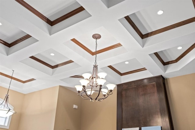 details featuring beamed ceiling, a chandelier, and crown molding