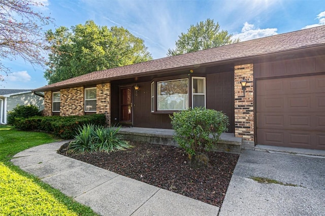 ranch-style house featuring a garage