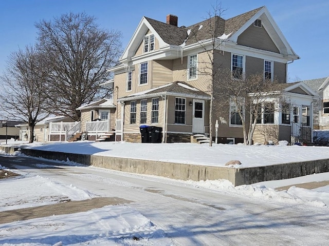 view of front of house featuring a chimney