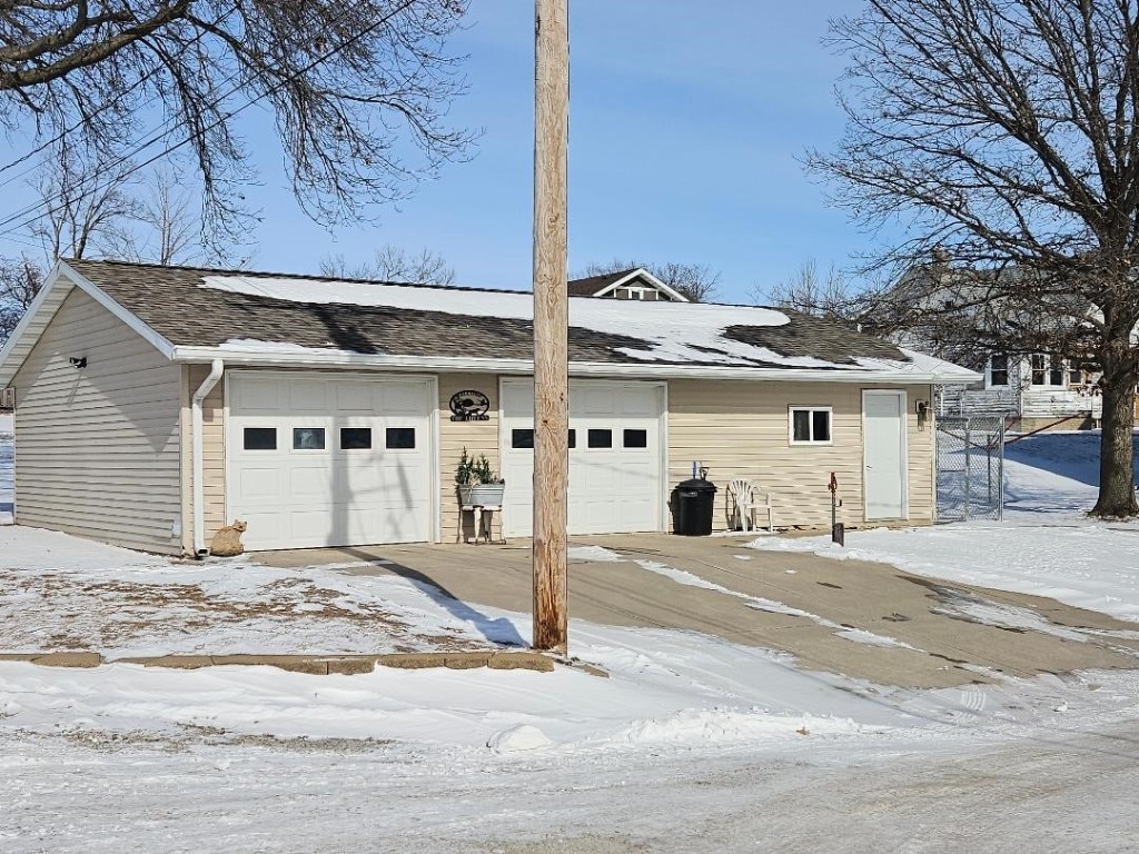 view of snow covered garage