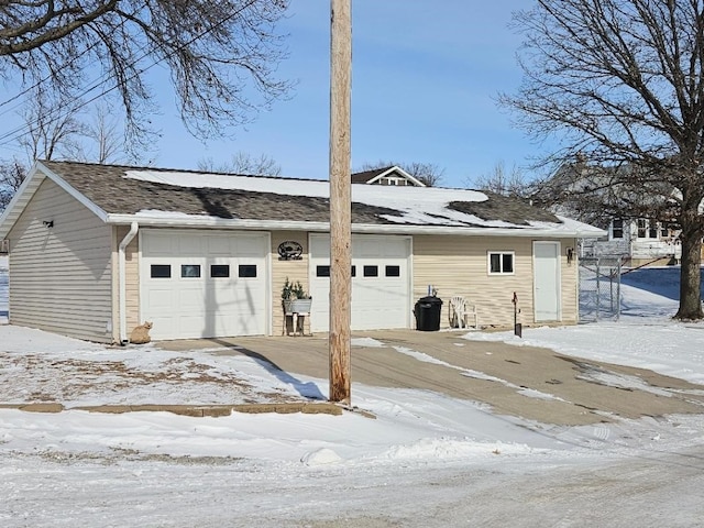 view of snow covered garage