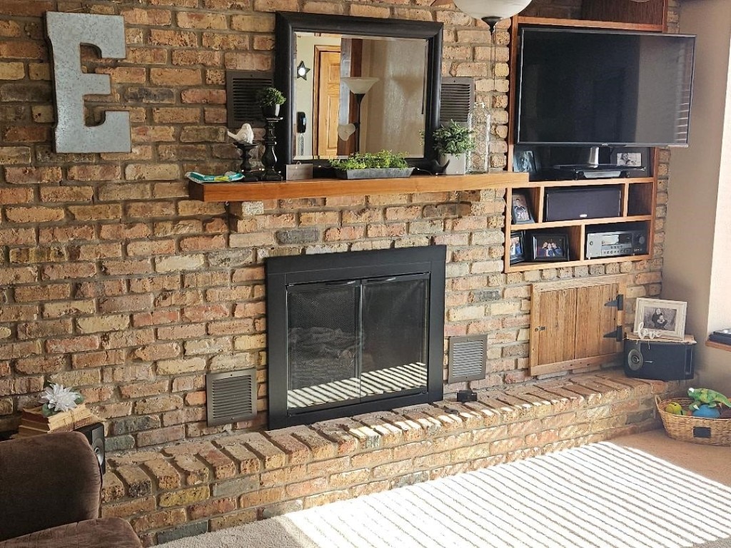 room details featuring a brick fireplace