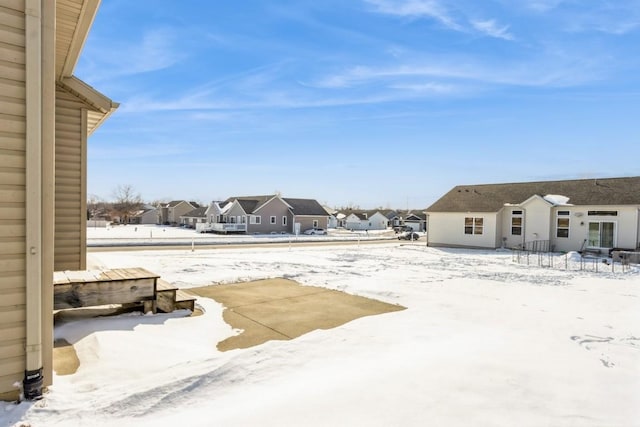 view of yard layered in snow