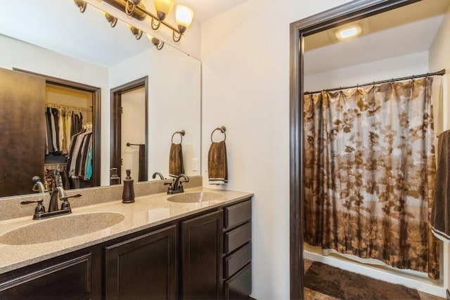 bathroom with vanity and a shower with shower curtain