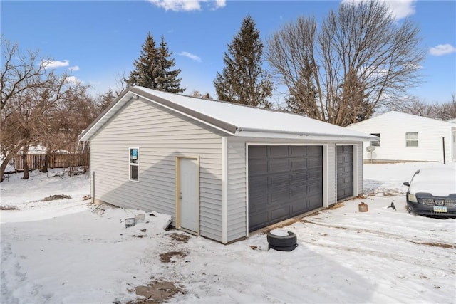 view of snow covered garage