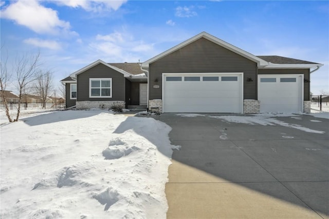 view of front of property featuring a garage and brick siding