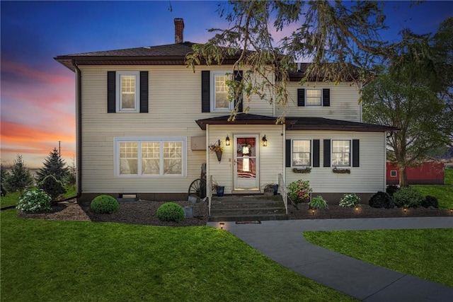 traditional-style home with a front yard