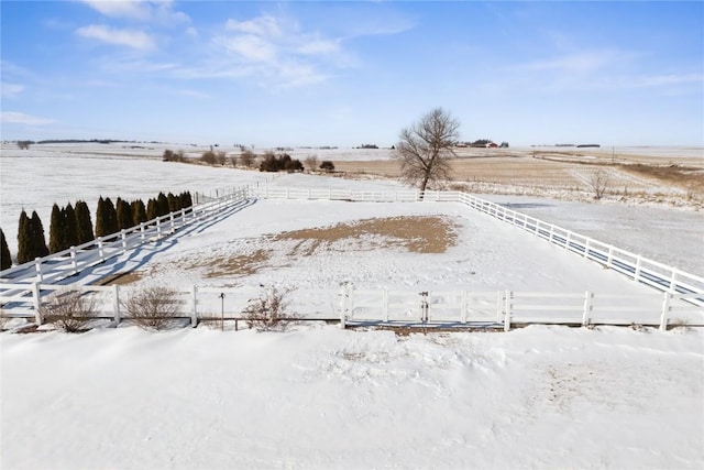 view of yard with a rural view and fence