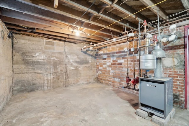 unfinished basement featuring a heating unit