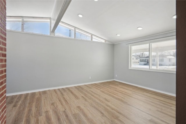 unfurnished room with vaulted ceiling with beams, light wood finished floors, baseboards, and recessed lighting