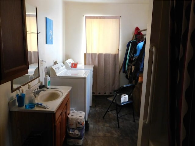 bathroom with washer and dryer and vanity