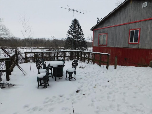 view of yard layered in snow