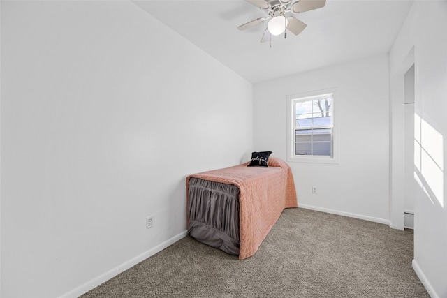 unfurnished bedroom with carpet flooring, a ceiling fan, and baseboards