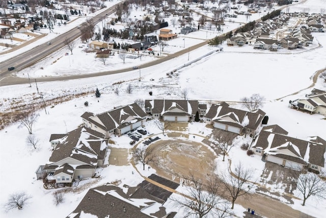 snowy aerial view featuring a residential view