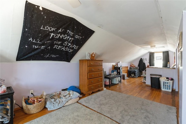 bonus room with vaulted ceiling and wood finished floors