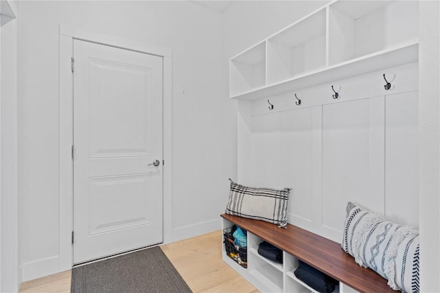 mudroom with light wood-type flooring and baseboards