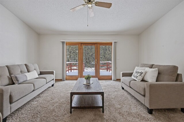 3440 Sunburst Ave, Marion, IA 52302 - living area featuring carpet flooring, a ceiling fan, and a textured ceiling