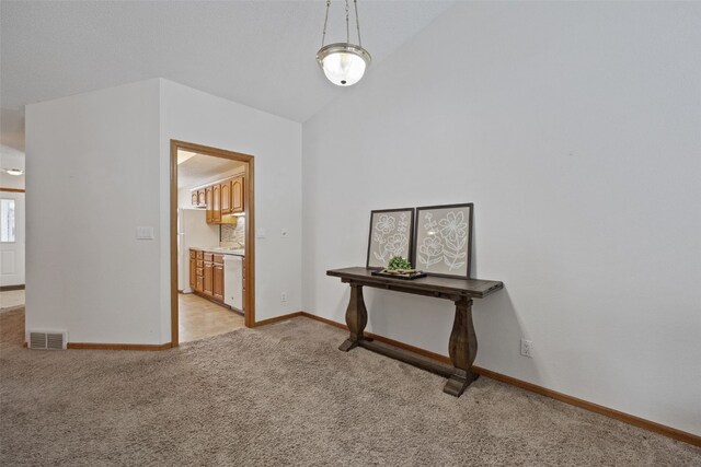 3440 Sunburst Ave, Marion, IA 52302 - hallway with baseboards, light carpet, lofted ceiling, and visible vents