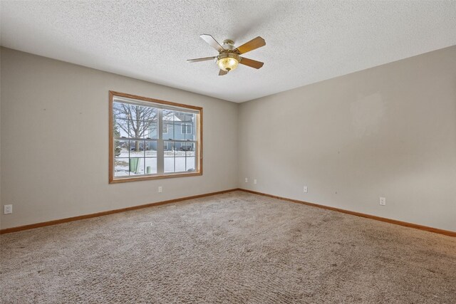 3440 Sunburst Ave, Marion, IA 52302 - empty room with baseboards, a ceiling fan, carpet, and a textured ceiling