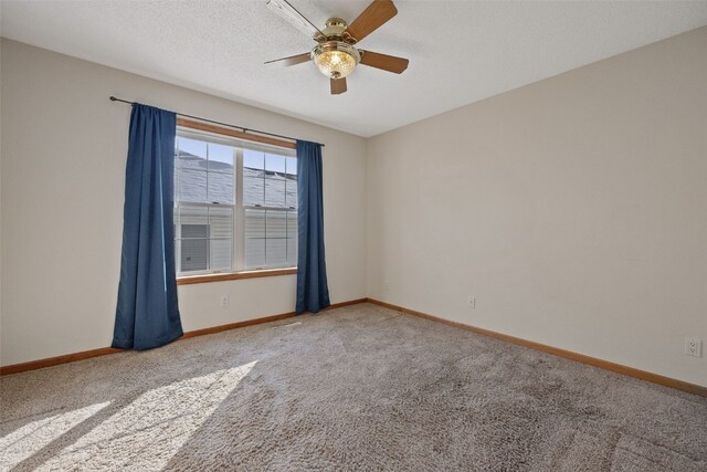 3440 Sunburst Ave, Marion, IA 52302 - carpeted spare room with baseboards and a ceiling fan