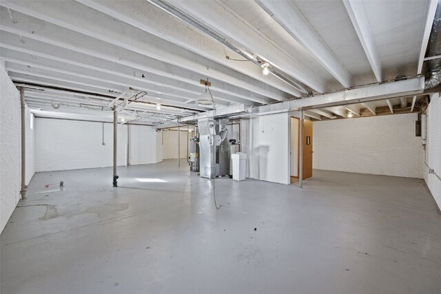 3440 Sunburst Ave, Marion, IA 52302 - unfinished basement featuring brick wall and heating unit