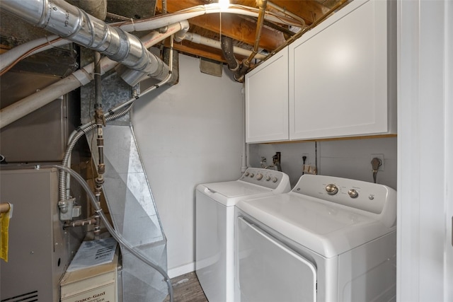 laundry area featuring cabinet space and washer and clothes dryer