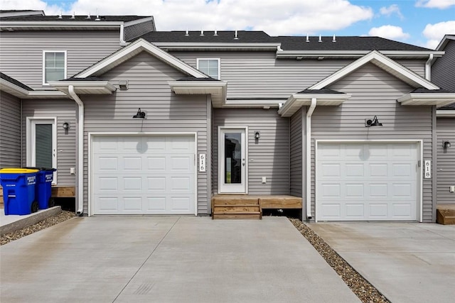 view of property with concrete driveway