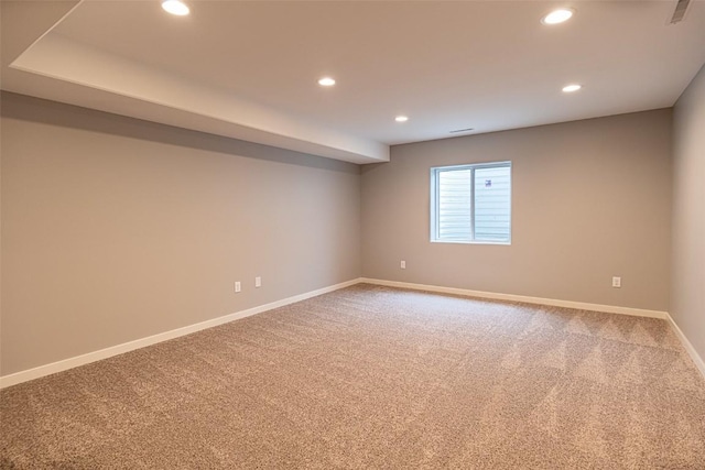 empty room featuring baseboards, carpet, visible vents, and recessed lighting