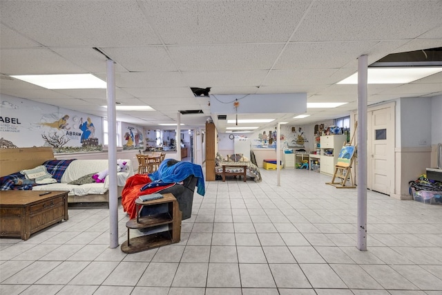 230 E Market St, Lisbon, IA 52253 - finished basement with a drop ceiling and light tile patterned floors
