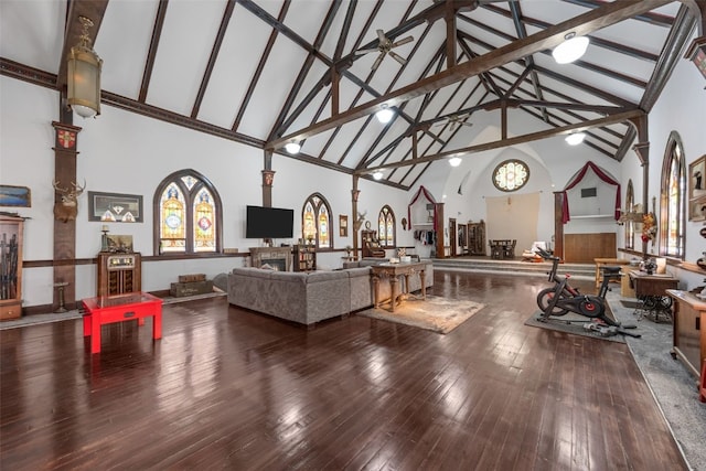 230 E Market St, Lisbon, IA 52253 - living area with ornate columns, high vaulted ceiling, wood finished floors, and ceiling fan with notable chandelier