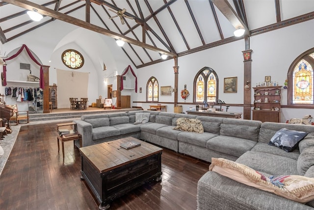 230 E Market St, Lisbon, IA 52253 - living room featuring dark wood-type flooring and high vaulted ceiling