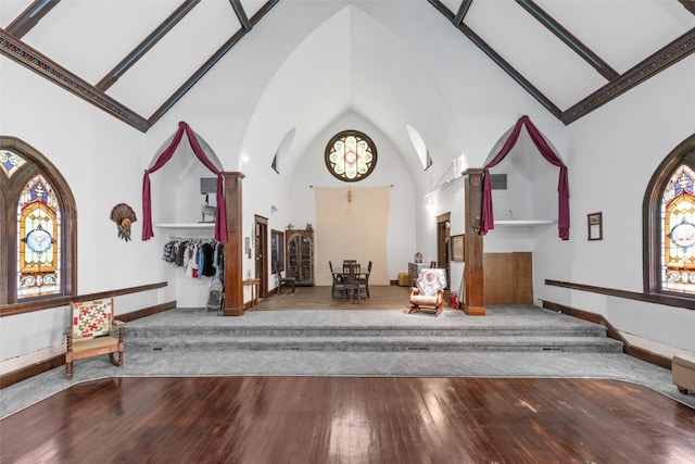 230 E Market St, Lisbon, IA 52253 - interior space with baseboards, high vaulted ceiling, and wood finished floors
