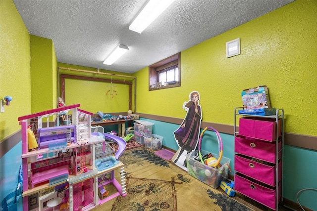230 E Market St, Lisbon, IA 52253 - game room featuring a textured wall and a textured ceiling