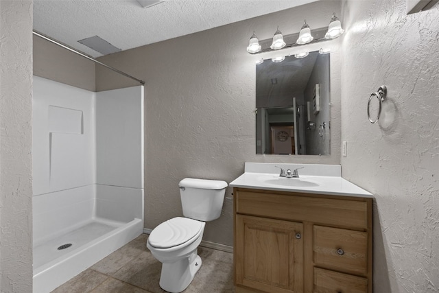 bathroom with a textured ceiling, a textured wall, toilet, vanity, and a shower stall