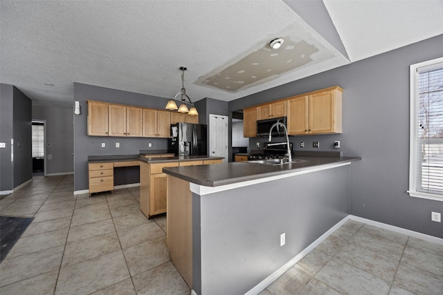 kitchen with a center island, decorative light fixtures, stainless steel appliances, dark countertops, and light brown cabinetry