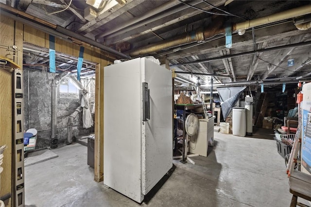 basement featuring freestanding refrigerator