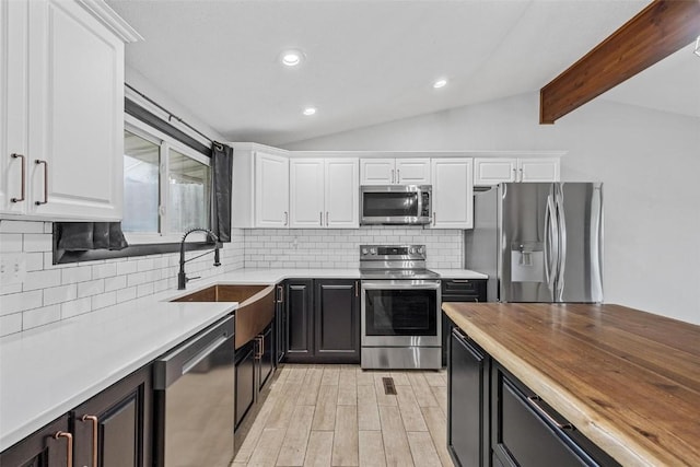 kitchen featuring white cabinetry and stainless steel appliances