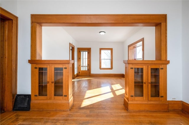 interior space with light wood-style flooring and baseboards